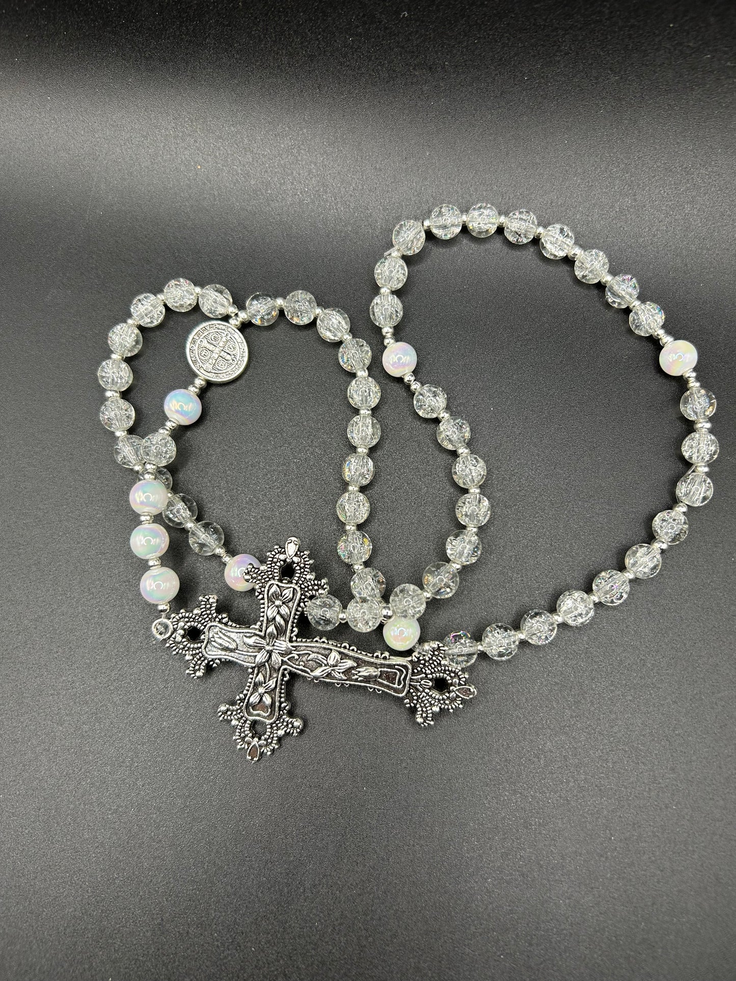 Catholic Rosary Black beads with Bronze Plated  Medal Centerpiece and a Clear Crystal 10 mm beads with a Sterling Silver cross. Green 10 mm gold spacers with a gold and emerald green cross.